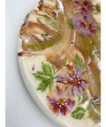 Close-up of 18 Inch Floral Epoxy Resin Lazy Susan With Turquoise Painted Wooden Base Farmhouse Serving Tray detailing floral design.