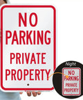 Tough As Nails No Parking Private Property Sign 12 X 18 Inch Heavy Duty Aluminum Sheet held by a person with clear red text.