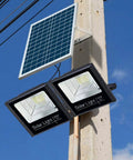 JUDYSSY Solar Flood Lights Solar Led Flood Lights mounted on pole with solar panel, designed for outdoor use.