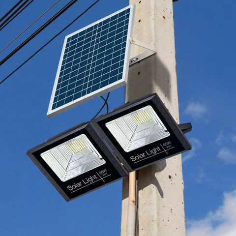 JUDYSSY Solar Flood Lights Solar Led Flood Lights mounted on pole with solar panel, designed for outdoor use.