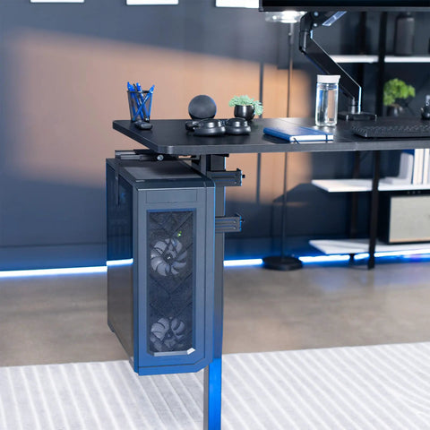 Hella Sturdy Clamp On Desk Leg Mount For Large PC Towers Under Desk CPU Storage Rack Easy Tool Free Setup Keeps Your Rig Off The Floor Gamer Battlestation Desk Organizer Black attached to a modern desk with a large PC tower.
