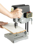 Totally Legit Heavy Duty Mini Bench Drill Press 340W Variable Speed Portable Tool With Rock Solid Cast Iron Base in use drilling wood.