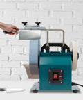 Heavy Duty Wet Bench Grinder Built Tough To Run Butter Smooth With Variable Speed Control For Dang Sharp Knives Axes Chisels And Everyday Sharpening Tasks with knife sharpening in progress.