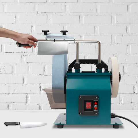 Heavy Duty Wet Bench Grinder Built Tough To Run Butter Smooth With Variable Speed Control For Dang Sharp Knives Axes Chisels And Everyday Sharpening Tasks with knife sharpening in progress.