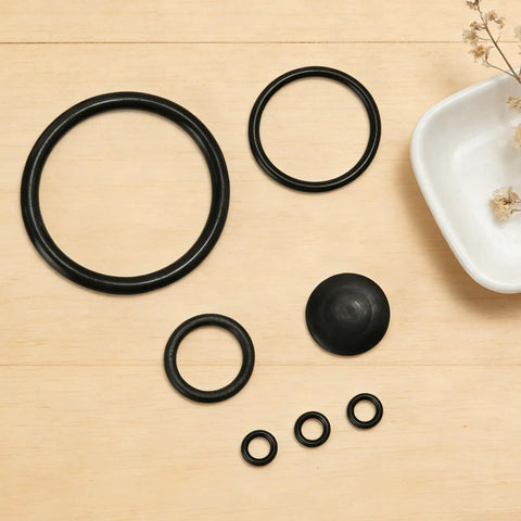Seal Gasket Set For 20000 Sprayers Replacement Parts Kit Includes Six Seals Across Four Sizes And One Rubber Base Pad Easy To Install Durable Sprayer Maintenance. Black rubber gasket rings and base pad for sprayer repair.