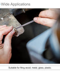 Close-up of hands using a file on a metal piece, highlighting heavy duty pneumatic air metal file set for smoothing steel.