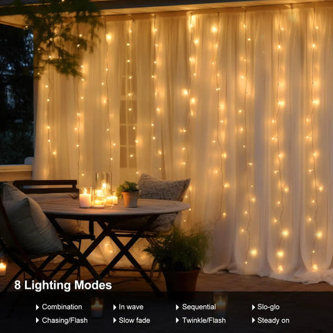 Battery Operated Fairy Curtain Lights With Remote Timer Nine Point Eight Feet By Nine Point Eight Feet Of Warm White LEDs illuminating patio