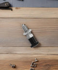 Stainless Steel Reset Indexing Plunger With Knob And Self Locking Mechanism M10 for mechanical tasks on wood surface.