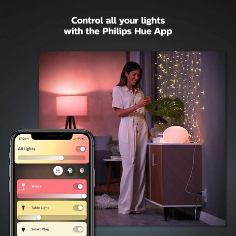 Hue Smart Plug Turns Any Lamp Into a Smart Light with no fuss, woman controls lights via Hue app on smartphone