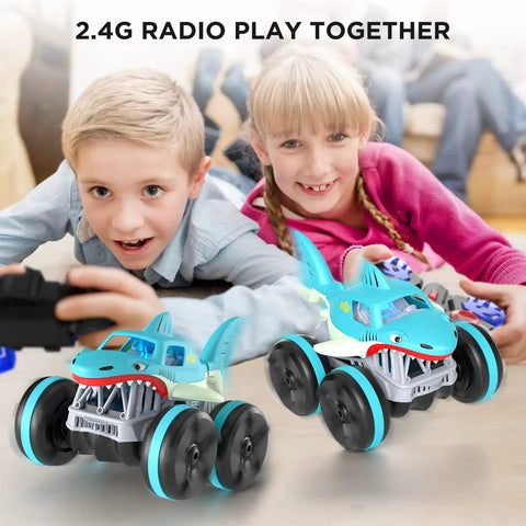 Kids playing with Amphibious RC Shark Car 1:14 Scale, 2.4GHz 4WD Waterproof All Terrain Monster Truck on living room floor