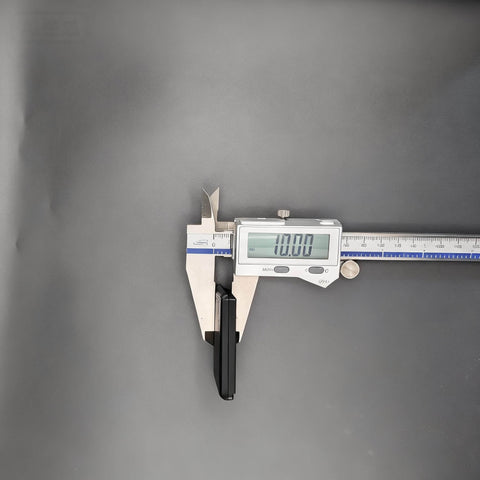 Digital caliper measuring a 4 Piece Magnetic Hold Down for Laser Engravers Rock Solid Magnetic Clamps with 10mm Grip.