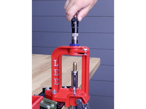 Dead Nuts Accurate Rifle Micrometer Adjustment Screw for Universal Bullet Seating Dies on a red press for precision reloading.