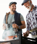 Two men using Upgraded Electric Salt And Pepper Grinder Set With Dual Charging Base at a barbecue.
