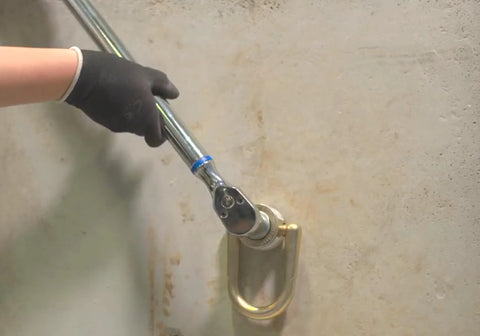 Installation of 10K Swivel Anchor Five Eighths Inch By Six Inches Expansion Anchor With Full Size D Ring In Zinc Plated Stainless Steel on concrete wall
