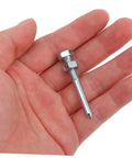 Close-up of a metal spike from Heavy Duty Lawn Aerator Shoes Spikes Set With 20 Metal Spikes For Grass Shoes, held in a hand.