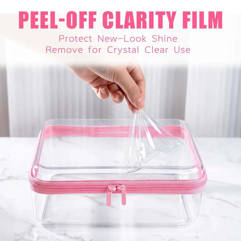 Person removing clarity film from Straight Up Heavy Duty Clear Hard Shell Zipper Cases for Diaper Bag Organizers.