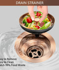 Hand holding basket of Dope Brass Kitchen Sink Drain Strainer Kit Three And A Half Inch Universal Fit With Removable Basket And Stopper