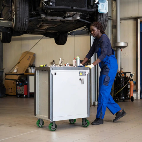 Mechanic using a tool cart with Beefy 8 Inch By 2 Inch Polyurethane Casters With Aluminum Wheel And Roller Bearing.