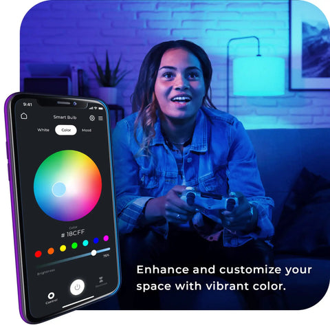 Person using smartphone to control WiFi Smart LED Bulb 10W 60W Equivalent Multicolor RGB Tunable White 2000K To 5000K A19 E26 Frosted No Hub Required Voice Activated Works With Google Assistant And Alexa Two Pack in living room.