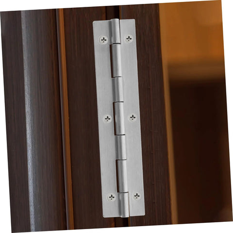 Installed brushed stainless steel piano hinge on a dark wood cabinet door; continuous heavy-duty hinge with screws