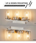 Three Light Brushed Nickel Bathroom Vanity Light Fixture With Clear Glass Shade Over Mirror, shown with up and down mounting options.
