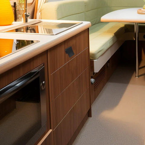 Modern RV kitchen with wood cabinets featuring sturdy Rv Drawer Latches With Locking Mechanism And Easy Install.