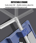Blue metal table vise with silver threaded lead screw and rotating crank; close-up view