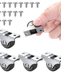 Hand holding one of the 4 Pack 1 Inch Small Non Swivel Caster Wheels With Top Plate And Screws Low Profile Rubber Casters for cabinets
