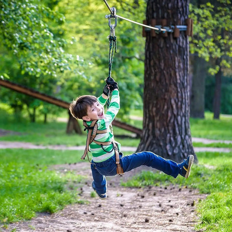 Child using One Quarter Inch Zipline Cable Heavy Duty Galvanized Steel Wire Rope For Home Backyard Zip Line Setup in a park
