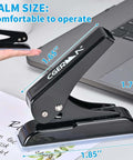 Palm-sized black heavy duty single hole punch, 0.25 inch holes, 30 sheet capacity, shown on desk with measurement overlay.