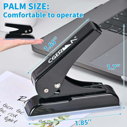 Palm-sized black heavy duty single hole punch, 0.25 inch holes, 30 sheet capacity, shown on desk with measurement overlay.