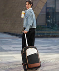 Woman with rolling suitcase backpack set, urban setting