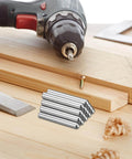 Must Have 70Pcs 2.8mm By 8mm Dowel Pins In 304 Stainless Steel Cylindrical Round Head Shelf Pegs Locating Pins For Bookshelves Cabinets And Furniture GB831 Silver Finish on a wooden surface with tools