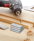 Eight 8mm By 45mm Dowel Pins In 304 Stainless Steel Round Head Shelves Support Pegs Locating Pins For Bookshelves And Cabinets Heavy Duty Durable Furniture Hardware Component Silver shown with drill and wood