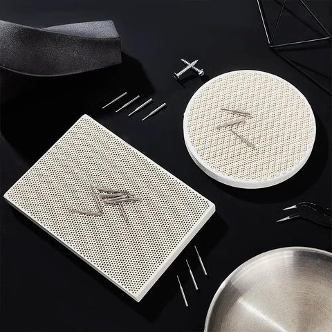 Honeycomb Ceramic Soldering Boards Set With 2 Round And Rectangle Boards And 20 Stainless Steel Needles For DIY Jewelry Making Melting And Casting Gold Tools displayed on black surface