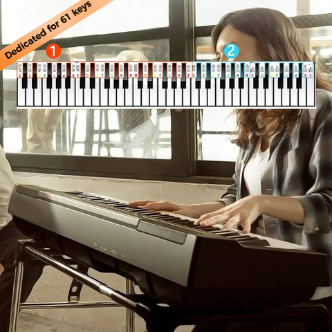 Person playing keyboard with 61 Key Note Sticker Guide Labels, showing color-coded notes for easy learning, in a bright room.