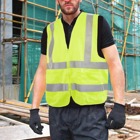 Top Shelf High Visibility Reflective Safety Vest, Fluorescent Neon Yellow, Heavy Duty Construction Work Gear With Roomy Pocket, Super Breathable Unisex Vest For Crews And Surveyors Daily worn by a man on a construction site.