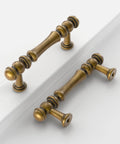 10 Pack 3 Inch Antique Brass Cabinet Pulls, Vintage Zinc Alloy Handles on white surface, showcasing aged brass finish