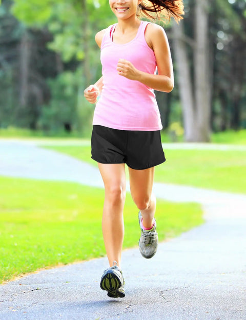 Running girl wearing Girls Athletic Shorts With Liner Quick Dry Running Soccer Shorts With Zip Pockets For Kids Active Sports