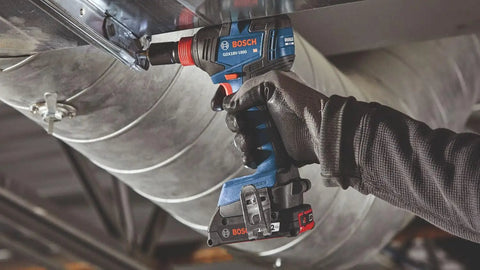 Using 18V Brushless Two Tool Combo Kit With Hammer Drill And Driver And Impact Driver Wrench Includes Two 2Ah Batteries For Quick Rugged Power On Any Jobsite under metal ductwork