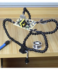 Third Hand Soldering Stand With Adjustable Metal Gooseneck Arms, PCB Holder Vise Table Clamp in use on wooden desk
