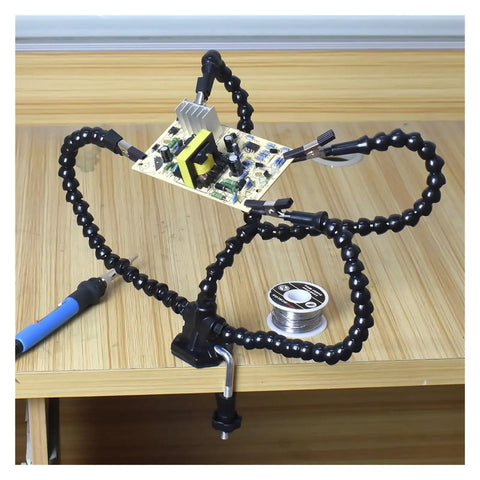 Third Hand Soldering Stand With Adjustable Metal Gooseneck Arms, PCB Holder Vise Table Clamp in use on wooden desk