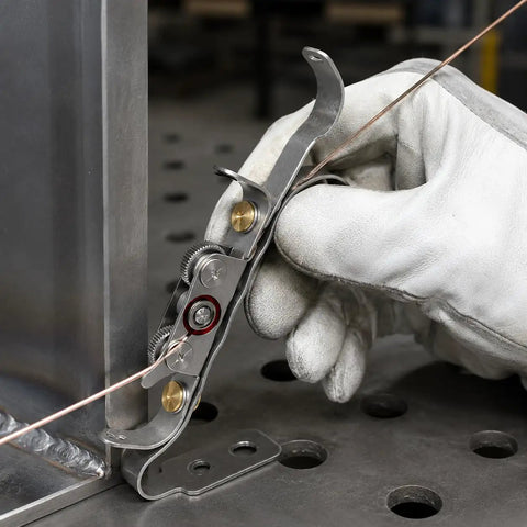 Ultimate TIG Wire Feeder Tool With Magnetic Base And Heat Shield For Alloy Filler Rods, close-up use for precise wire guiding.
