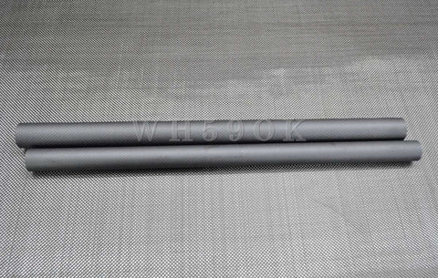 Two One Piece 3K Carbon Fiber Tube 28x26mm for drones and aircraft, glossy or matte finish, laying parallel on a textured surface.