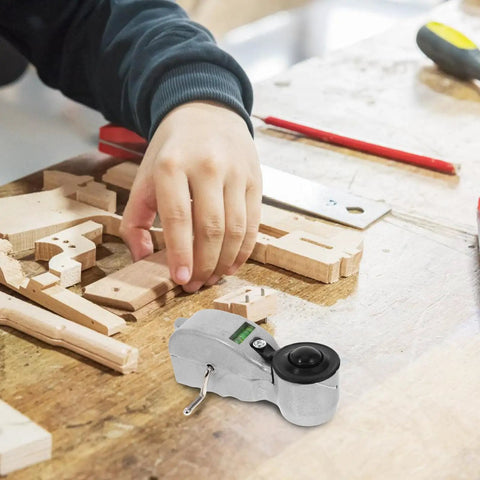 Precision Rugged Aluminum Fountain Scriber Line Tool For Construction And Woodworking Lightweight Ink Level Marker on wooden workbench with hand.