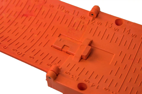 Close-up of The Fish Stik 12 Inch To 36 Inch Telescoping Measuring Stick With Marker For Darkened Measurements, orange color, folded.