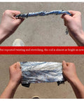 Hands demonstrating Heavy Duty Self Adhesive Ice And Water Shield Roof Underlayment, showcasing flexibility and durability after stress testing.