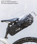 Expandable Waterproof Bikepacking Saddle Bag With 3L Capacity Large Seat Bag for Cyclists, mounted on bike under water spray
