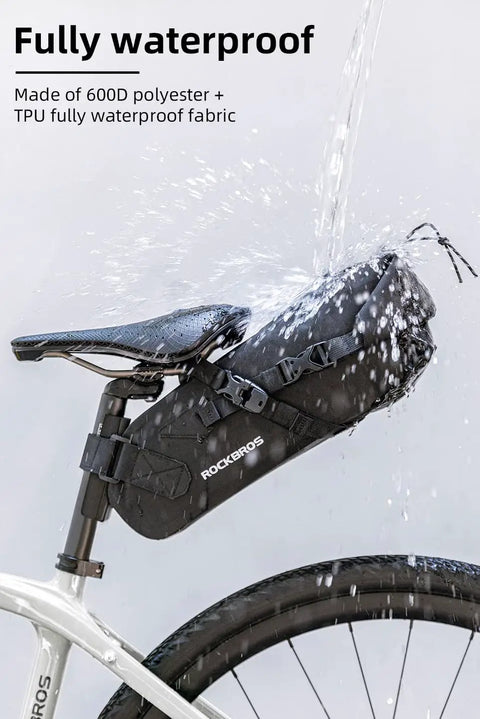 Expandable Waterproof Bikepacking Saddle Bag With 3L Capacity Large Seat Bag for Cyclists, mounted on bike under water spray