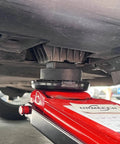 Dual Use Lifting Axle Saddle Adapter Pads, 2 Pack For BMW X3 X5 X6 X7 And Mini, used with red hydraulic jack lifting vehicle